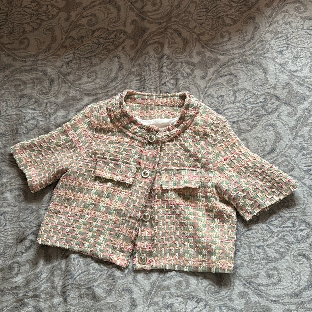 Textured mini jacket with a hint of Coquette!